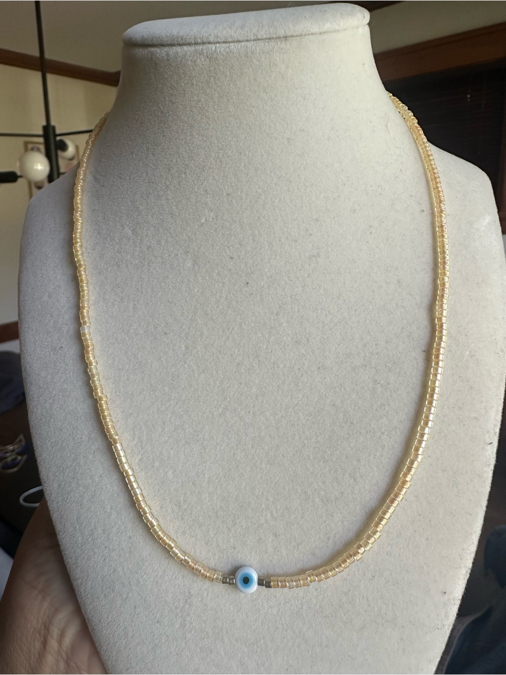 Delicate Cream Beaded Necklace with Blue Eye Charm